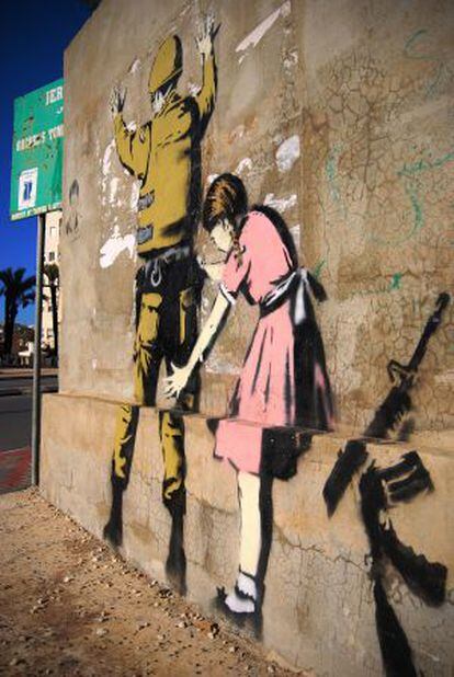 Obra do artista britânico Banksy na Cisjordânia.