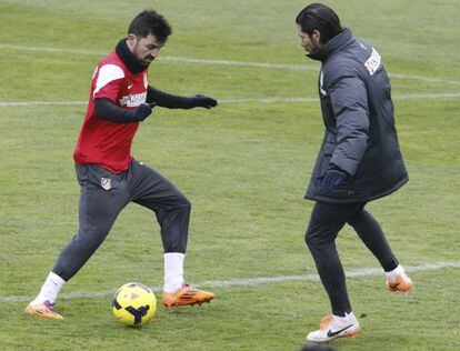 Villa e Simeone, durante um treino.