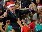 Brazil's President Jair Bolsonaro poses for a  picture wearing a Santa Claus hat during  a Christmas ceremony at Planalto Palace in Brasilia, Brazil December 19, 2019. REUTERS/Adriano Machado