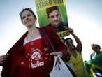 A supporter of former Brazilian President Lula da Silva is seen near a protester who is against him in Brasilia