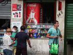 People gather outside a grocery store in the Copacabana neighborhood following the coronavirus disease (COVID-19) outbreak, in Rio de Janeiro, Brazil April 29, 2020. Picture taken April 29, 2020. REUTERS/Pilar Olivares