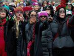 FILE PHOTO: Members of Las Tesis perform the Chilean feminist protest anthem "Un violador en tu camino"  (A Rapist in Your Path" during the 2020 Women's March in Washington, U.S., January 18, 2020.      REUTERS/Mary F. Calvert/File Photo