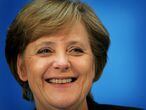 Germany's Christian Democratic Union (CDU) leader Angela Merkel smiles during a news conference in Berlin October 10, 2005. The leadership of Merkel's CDU has approved the start of formal coalition negotiations with Germany's Social Democrats (SPD).   REUTERS/Kai Pfaffenbach
