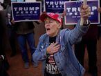 A supporter of President Donald Trump holds her hand over her heart during a protest of the election outside of the Clark County Election Department in North Las Vegas on Nov. 8, 2020. (AP Photo/John Locher)