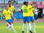 Brazil's midfielder Marta (C-R) celebrates with teammates after scoring the opening goal during the Tokyo 2020 Olympic Games women's group F first round football match between China and Brazil at the Miyagi Stadium in Miyagi on July 21, 2021. (Photo by AFP)