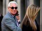 (FILES) In this file photo taken on November 5, 2019 Roger Stone, former adviser to US President Donald Trump, enters the E. Barrett Prettyman United States Court House with his wife Nydia (C) and daughter Adria Stone(R) in Washington, DC. - US President Donald Trump communted the 40-month prison sentence of longtime ally Roger Stone on July 10, 2020, the White House said. (Photo by Andrew CABALLERO-REYNOLDS / AFP)
