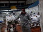 Nurses work during the New Year at a field hospital set up at a sports gym to treat patients suffering with the coronavirus disease (COVID-19) in Santo Andre, Sao Paulo state, Brazil, January 1, 2021. REUTERS/Amanda Perobelli