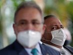 FILE PHOTO: Brazil's newly-replaced Health Minister Eduardo Pazuello looks on next to Brazilian cardiologist Marcelo Queiroga, who was named by Brazil's President Jair Bolsonaro as the country's fourth Health Minister since the coronavirus pandemic began, at the Health Ministry headquarters in Brasilia, Brazil March 16, 2021. REUTERS/Ueslei Marcelino/File Photo