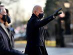 WASHINGTON, DC - JANUARY 20: U.S. President Joe Biden waves from the abbreviated parade route after Biden's inauguration on January 20, 2021 in Washington, DC. Biden became the 46th president of the United States earlier today during the ceremony at the U.S. Capitol.   Mark Makela/Getty Images/AFP
== FOR NEWSPAPERS, INTERNET, TELCOS & TELEVISION USE ONLY ==
