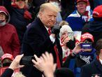 President Donald Trump gestures to supporters after speaking at a campaign rally at Oakland County International Airport, Friday, Oct. 30, 2020, in Waterford Township, Mich. (AP Photo/Jose Juarez)