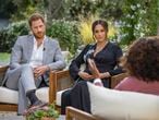 FILE - This image provided by Harpo Productions shows Prince Harry, from left, and Meghan, Duchess of Sussex, in conversation with Oprah Winfrey. Almost as soon as the interview aired, many were quick to deny Meghan’s allegations of racism on social media. Many say it was painful to watch Meghan's experiences with racism invalidated by the royal family, members of the media and the public, offering up yet another example of a Black woman's experience being disregarded and denied. (Joe Pugliese/Harpo Productions via AP, File)