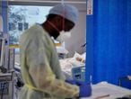 A COVID-19 patient receives treatment in the ICU (Intensive Care Unit) at Milton Keynes University Hospital, amid the spread of the coronavirus disease (COVID-19) pandemic, Milton Keynes, Britain, January 20, 2021. Picture taken January 20, 2021. REUTERS/Toby Melville