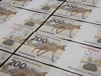 Brasilia (Brazil), 02/09/2020.- A handout photo made available by the Central Bank of Brazil shows several of the new 200 reais banknotes, Brasilia, Brazil, Issued 02 September. The bill has the image of the Guara wolf, the largest Canidae in South America, and has entered circulation since on 02 September. The Central Bank ordered the Mint to produce 450 million notes of the new note until December. (Brasil) EFE/EPA/Raphael Ribeiro / Central Bank of Brazil HANDOUT HANDOUT EDITORIAL USE ONLY/NO SALES