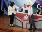 Peru's socialist candidate Pedro Castillo and his opponent, right-wing candidate Keiko Fujimori fist bump as they start their last debate ahead of the June 6 run-off election, in Arequipa, Peru May 30, 2021. REUTERS/Sebastian Castaneda/Pool