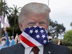 A cardboard cutout of U.S. President Donald Trump wearing a mask is seen at a protest over the stay-at-home orders involving the closing of beaches and walking paths during the outbreak of the coronavirus disease (COVID-19) in Encinitas, California, U.S., April 19, 2020.      REUTERS/Mike Blake