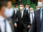 Brazil's President Jair Bolsonaro wearing a protective mask walks to the Planalto Palace after a meeting with President of Brazil's Supreme Federal Court Dias Toffoli, amid the coronavirus disease (COVID-19) outbreak, at the Supreme Federal Court in Brasilia, Brazil May 7, 2020. REUTERS/Adriano Machado