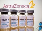 FILE PHOTO: Vials with a sticker reading, "COVID-19 / Coronavirus vaccine / Injection only" and a medical syringe are seen in front of a displayed AstraZeneca logo in this illustration taken October 31, 2020. REUTERS/Dado Ruvic/File Photo/File Photo