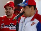 Nicolas Maduro Guerra, son of Venezuela’s President Nicolas Maduro and member of the National Constituent Assembly, looks as his father talks to the media before a softball game with ministers and military high command members at Fuerte Tiuna military base, in Caracas, Venezuela January 28, 2018. REUTERS/Marco Bello - RC1A9BC02300