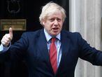 FILE PHOTO: Britain's Prime Minister Boris Johnson reacts outside 10 Downing Street during the Clap for our Carers campaign in support of the NHS, following the outbreak of the coronavirus disease (COVID-19), London, Britain, May 7, 2020. REUTERS/Hannah McKay/File Photo