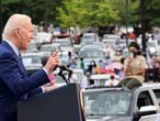 FILE PHOTO: U.S. President Joe Biden gestures as he speaks during the Democratic National Committee's "Back on Track" drive-in car rally to celebrate the president's 100th day in office at the Infinite Energy Center in Duluth, Georgia, U.S., April 29, 2021. REUTERS/Evelyn Hockstein/File Photo