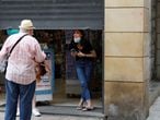People talk on the street after a judge barred Catalan authorities from enforcing a stricter lockdown to residents in the city of Lleida, to control the coronavirus disease (COVID-19) outbreak, in Lleida, Spain, July 13, 2020. REUTERS/Nacho Doce