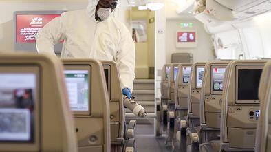 A handout image provided by Emirates airlines on March 8, 2020 in Dubai shows a member of the cleaning staff spraying disinfectant aboard an Emirates Airbus A380-800 aircraft for sterilisation efforts amidst efforts against COVID-19 coronavirus disease. (Photo by - / Emirates Airlines / AFP) / === RESTRICTED TO EDITORIAL USE - MANDATORY CREDIT "AFP PHOTO / HO / EMIRATES" - NO MARKETING NO ADVERTISING CAMPAIGNS - DISTRIBUTED AS A SERVICE TO CLIENTS ===