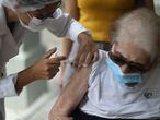 Layde de Caldas Costa, 102, receives the AstraZeneca/Oxford vaccine for the coronavirus disease (COVID-19) at a public hospital in Rio de Janeiro, Brazil, February 1, 2021. REUTERS/Pilar Olivares