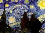 Visitors wearing face masks attend the "Meet Vicent Van Gogh" exhibition, as the spread of the coronavirus disease (COVID-19) continues, in Lisbon, Portugal, May 29, 2020. REUTERS/Rafael Marchante