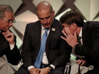 Paulo Guedes, Onyx Lorenzoni e Bolsonaro no Fórum de Investimento, em São Paulo, nesta quinta-feira. 