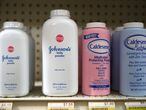 (FILES) In this file photo taken on October 18, 2019 containers of Johnson's baby powder made by Johnson and Johnson sit on a shelf at Jack's Drug Store in San Anselmo, California. - Pharmaceutical giant Johnson & Johnson announced on May 19, 2020 that it would stop selling talc-based baby powder in the United States and Canada, where sales had already been hit by changing consumer habits and fears the product causes cancer. (Photo by JUSTIN SULLIVAN / GETTY IMAGES NORTH AMERICA / AFP)