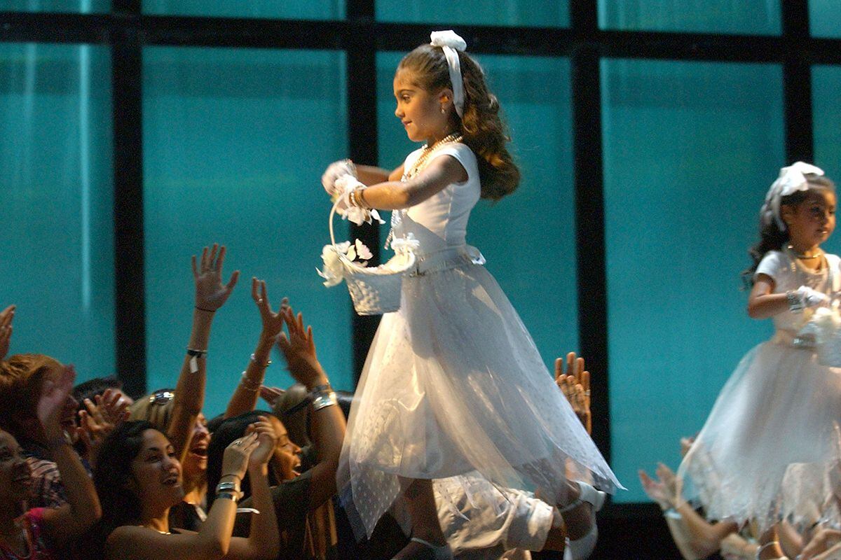 NEW YORK - AUGUST 28:  Lourdes Leon, daughter of Madonna dressed in a flower girl dress onstage during the 2003 MTV Video Music Awards at Radio City Music Hall on August 28, 2003 in New York City.  (Photo by Frank Micelotta/Getty Images)