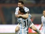 Argentina's Lionel Messi celebrates with teammate Angel Di Maria scoring his side's third goal against Ecuador during a Copa America quarterfinal soccer match at the Olimpico stadium in Goiania, Brazil, Saturday, July 3, 2021. (AP Photo/Andre Penner)