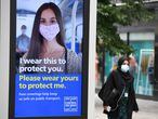 A pedestrian wears a facemask in the city centre of Leeds, on July 23, 2020, as lockdown restrictions continue to be eased during the novel coronavirus COVID-19 pandemic. - The wearing of facemasks in shops in England will be compulsory from Friday, but full guidance is yet to be published. (Photo by Oli SCARFF / AFP)