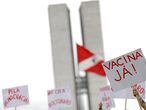 A demonstrator takes part in a protest asking for vaccine for the coronavirus disease (COVID-19) and against Brazilian President Jair Bolsonaro, in Brasilia, Brazil, December 23, 2020. REUTERS/Ueslei Marcelino