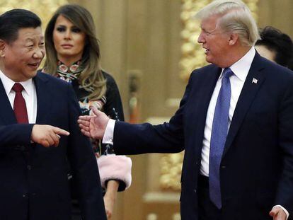Donald Trump, à direita, ao lado de Xi Jinping, em novembro, em Pequim