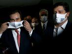 President of Brazil's Lower House Rodrigo Maia adjusts his protective face mask next to deputy Baleia Rossi, candidate for the presidency of Lower House for next elections, before a news conference at the National Congress in Brasilia, Brazil, January 6, 2021. REUTERS/Adriano Machado