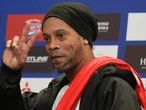 Brazilian former footballer Ronaldinho Gaucho gestures during a press conference in Bogota on October 16, 2019.
