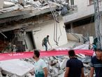 People inspect the rubble of destroyed residential building that was hit by an Israeli airstrike, in Gaza City, Monday, May 17, 2021. (AP Photo/Adel Hana)
