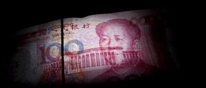Nota de 100 yuans com o rosto de Mao Tsé-Tung.