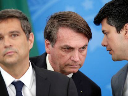 Presidente do Banco Central, Roberto Campos Netos, Jair Bolsonaro, e o presidente do BNDES, Gustavo Montezano durante o anúncio em Brasília.