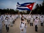 A brigade of health professionals, who volunteered to travel to South Africa to assist local authorities with an upsurge of coronavirus cases, attend the farewell ceremony in Havana, Cuba, Saturday, April 25, 2020. (AP Photo/Ramon Espinosa)