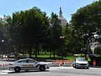 US Capitol police block a street during an investigation of a possible bomb threat near the US Capitol and Library of Congress in Washington, DC, on August 19, 2021. - Police said Thursday a suspicious vehicle was being investigated for possible explosives and that people were told to leave the area. "The USCP is responding to a suspicious vehicle near the Library of Congress," the US Capitol Police said on its Twitter feed.  "This is an active bomb threat investigation." The Federal Bureau of Investigation says it has also joined the probe. (Photo by Nicholas Kamm / AFP)