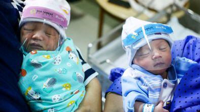 Newborn babies are seen in a hospital wearing protective face shields amid the coronavirus disease (COVID-19) outbreak in Jakarta, Indonesia, April 14, 2020 in this photo taken by Antara Foto.  Antara Foto/Rivan Awal Lingga/ via REUTERS ATTENTION EDITORS - THIS IMAGE WAS PROVIDED BY A THIRD PARTY. MANDATORY CREDIT. INDONESIA OUT. TPX IMAGES OF THE DAY