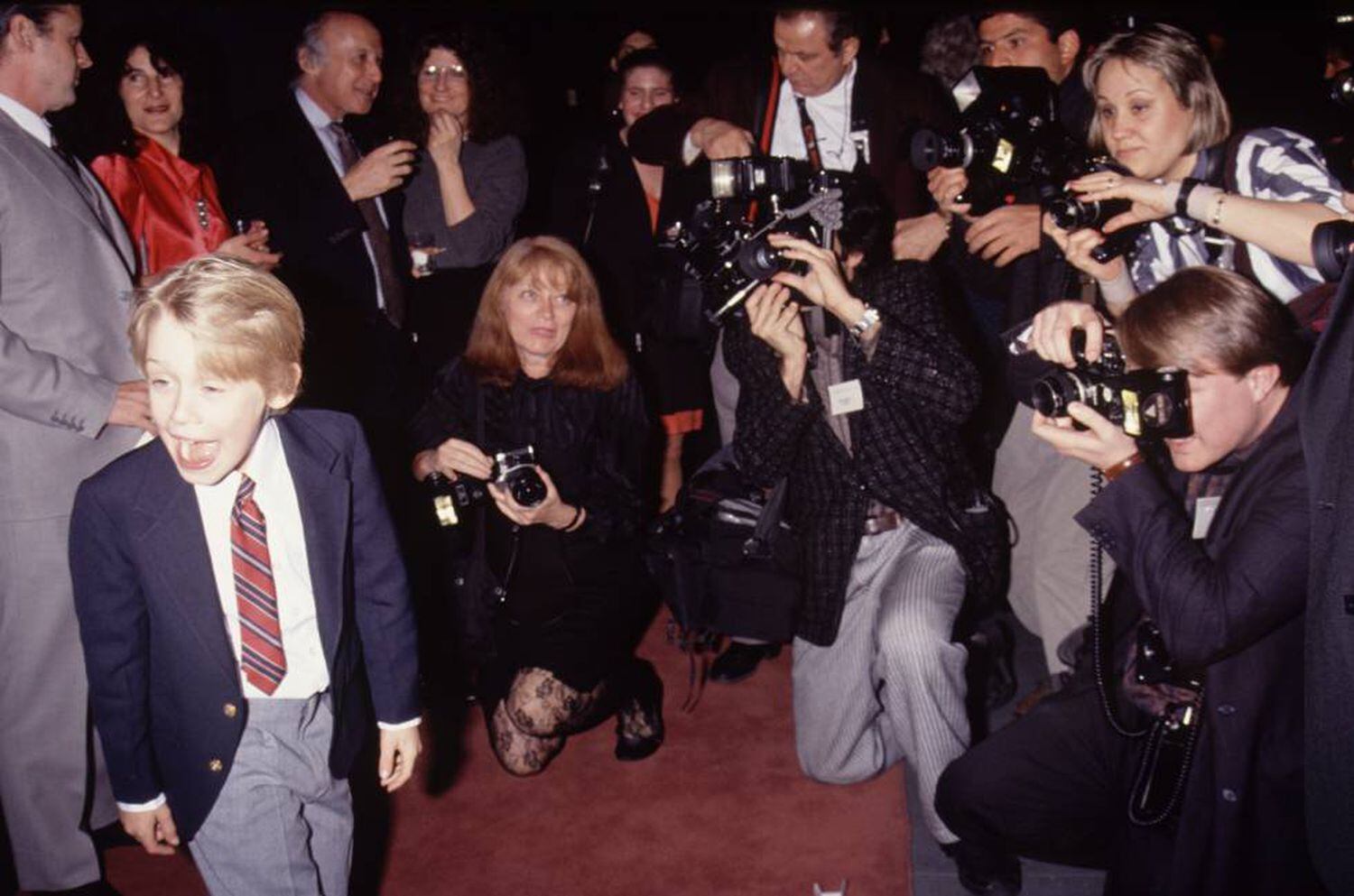 Macaulay Culkin, com10 anos, em um evento realizado em 1990, ano em que filmou 'Esqueceram de Mim'. O filme se tornou a terceira maior bilheteria até aquele momento (depois de E. T. e Guerra nas Estrelas).