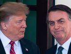 (FILES) In this file photo taken on March 19, 2019 US President Donald Trump (L) welcomes Brazilian President Jair Bolsonaro to the White House in Washington, DC. - Jair Bolsonaro made the "ideological" alignment of the Brazilian diplomacy public when he came to power and tried to get close to countries which incarnated the ultraconservative wave which was expanding across the world. Two years later, the wave reverted in many countries and Donald Trump's defeat threatens to leave Brazil isolated from the international scene. (Photo by Jim WATSON / AFP)