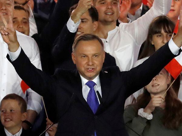 Polish President and presidential candidate of the Law and Justice (PiS) party Andrzej Duda gestures after the announcement of the first exit poll results on the second round of the presidential election in Pultusk, Poland, July 12, 2020. REUTERS/Kacper Pempel