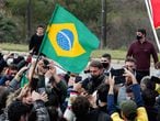 Brazil's President Jair Bolsonaro is greeted by supporters, amid the coronavirus disease (COVID-19) outbreak, in Bage, Rio Grande do Sul state, Brazil, July 31, 2020. Alan Santos/Brazilian Presidency/Handout via REUTERS ATTENTION EDITORS - THIS IMAGE WAS PROVIDED BY A THIRD PARTY.