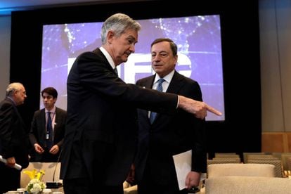 Jerome Powell, presidente da Reserva Federal, e Mario Draghi, presidente do BCE.