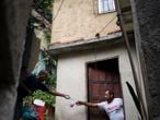 A local volunteer hands soap to a resident in an effort to avoid the spread of the new coronavirus in the Rocinha slum of Rio de Janeiro, Brazil, Tuesday, March 24, 2020. (AP Photo/Leo Correa)