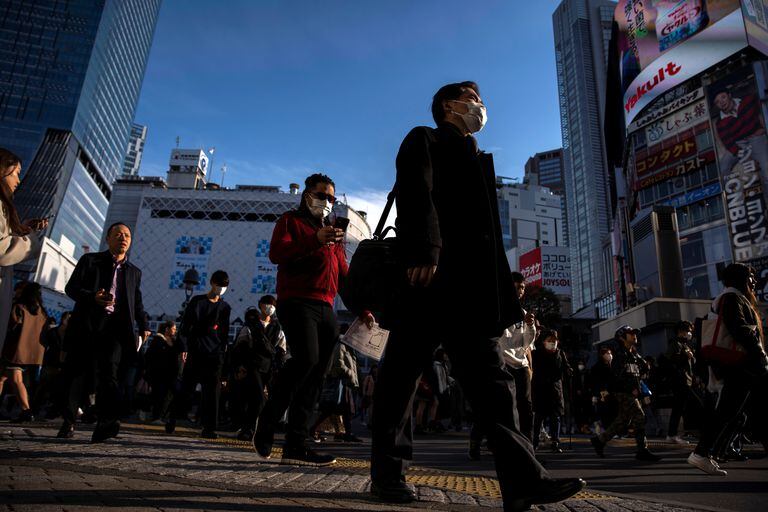People wearing protective masks are seen at the scramble crossing in Shibuya shopping district, also known as Shibuya crossing, following an outbreak of the coronavirus in Tokyo, Japan, March 3, 2020. REUTERS/Athit Perawongmetha